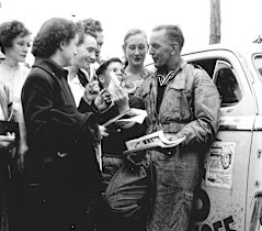 Crowd favourite Gelignite Jack Murray signs autographs for fans during the 1955 Redex Trial.