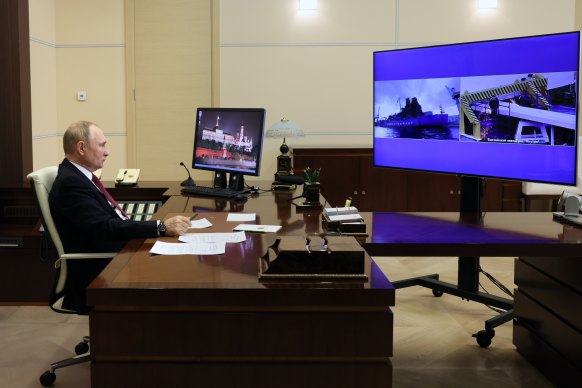 Russian President Vladimir Putin watches the launch via videoconference.