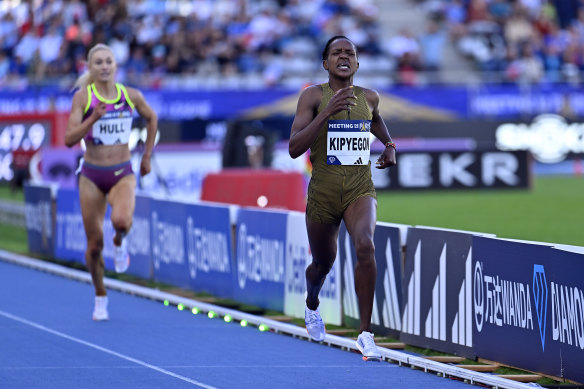 Faith Kipyegon on her way to a record victory in Paris, with Jessica Hull behind her.