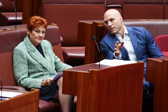 Not impressed: David Pocock (right) in discussion with Pauline Hanson.  