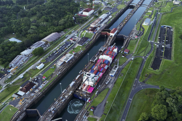 A cargo ship traverses the Panama Canal.