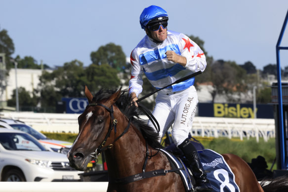 Tommy Berry punches the air as Stay Inside wins the Golden Slipper.
