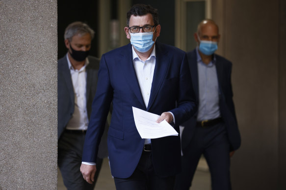 Victorian Premier Daniel Andrews (centre), Chief Health Officer Brett Sutton (left) and COVID-19 response commander Jeroen Weimar (right) on Wednesday.