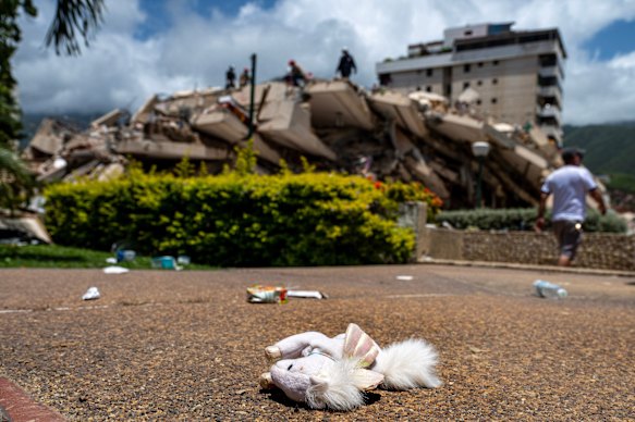 A child’s toy lies near a damaged building in Caraballeda.