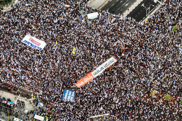 People take part in a demonstration supporting Israeli Prime Minister Benjamin Netanyahu and his nationalist coalition government’s judicial overhaul, in Tel Aviv on Sunday.