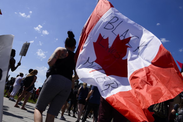 People take part in an anti-racism protest on Parliament Hill during the coronavirus pandemic in Ottawa, Ontario, on Friday.