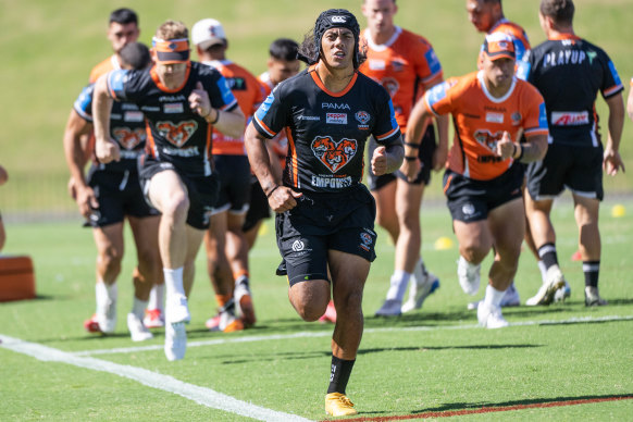 Jarome Luai leads the way at Tigers training on Wednesday.