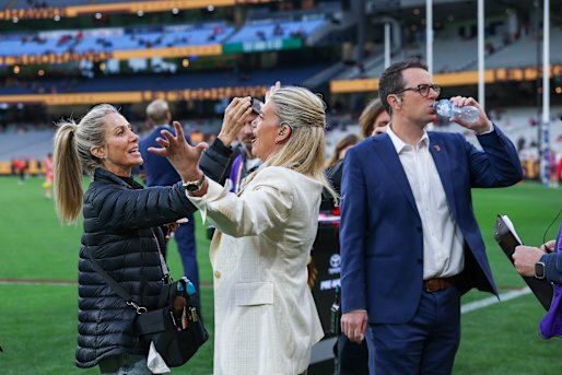 Rebecca Maddern and boundary reporter Mitch Cleary before the game.