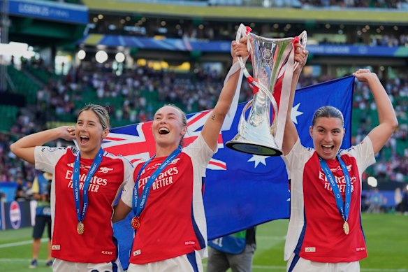 Arsenal’s Australian contingent of Kyra Cooney-Cross, Caitlin Foord and Steph Catley celebrate their Champions League final win.