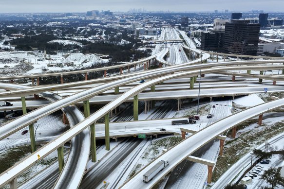 An icy mixture covers an interchange in Dallas.