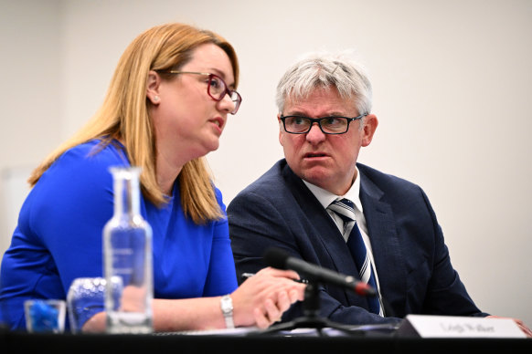 EY representatives Leigh Walker (left) and Dean Yates appear before the inquiry on Monday.