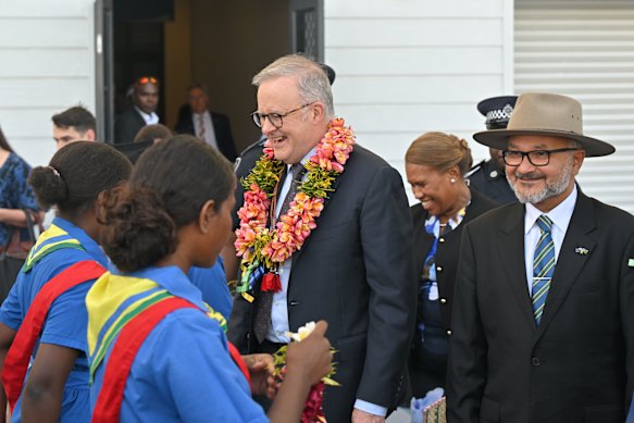 Australia’s Prime Minister Anthony Albanese and Solomon Islands Prime Minister Matthew Wale receive garlands during Independence Day celebrations at National Stadium in Honiara.