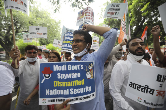 Congress party workers demonstrate in 2021 accusing the Indian government of using Pegasus spyware.