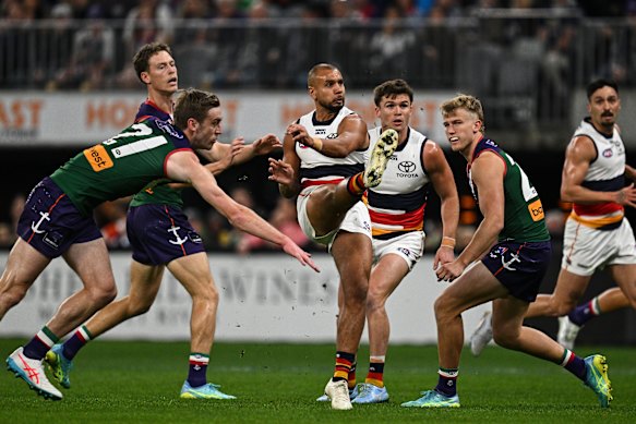 Callum Ah Chee of the Crows kicks a goal.