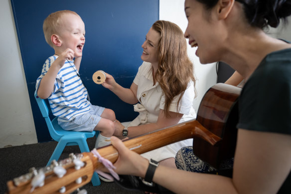 An NDIS participant in a music therapy session.