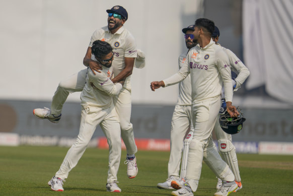 Mohammed Siraj leaps on the back of Ravindra Jadeja after he took his seventh wicket during the third day.