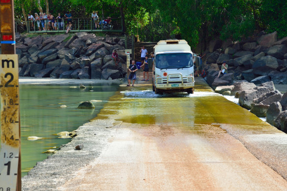 Timing is everything – over the causeway at Cahills Crossing.