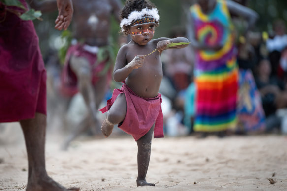 Dancers of all ages stomp into dust clouds.