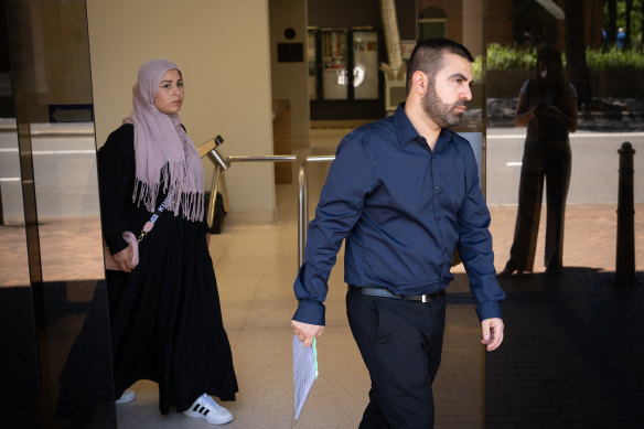 Alleged telco fraudster Qartullah Sulaiman (right) leaves Parramatta Local Court.
