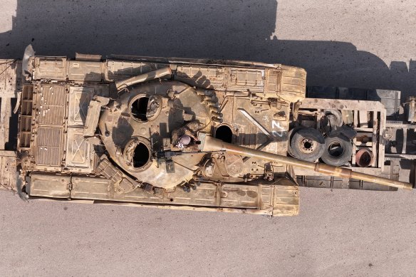 A tank in Baniyas being transported by fighters with the new Syrian government.