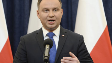 Polish President Andrzej Duda announces his decision to sign legislation penalising certain statements about the Holocaust, in Warsaw on Tuesday.