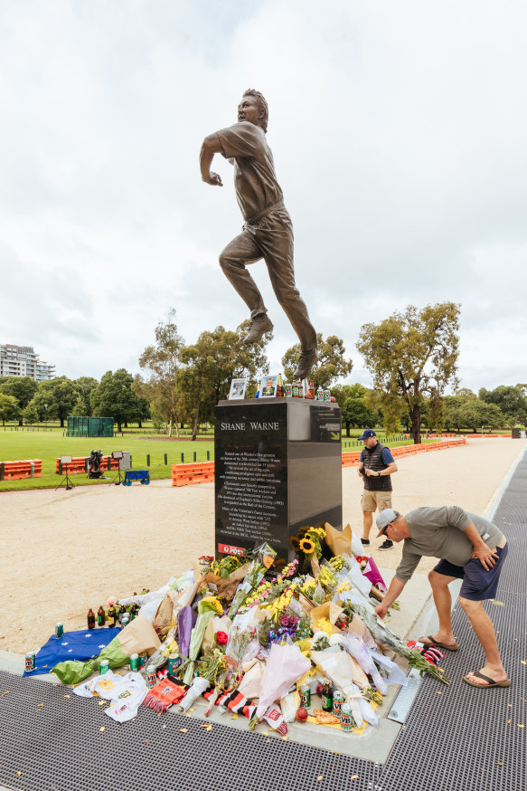 Mourning the death of Shane Warne at his statue outside the MCG in March.