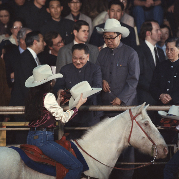 Deng Xiaoping receives a stetson hat at a Houston rodeo during a visit in 1979.