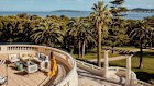 The sloping lawns, seen from the terrace of the two-bedroom suite, lead to the beach club and shimmering-tiled 25-metre pool at COMO Le Beauvallon. 