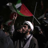 A cleric chants slogans during an anti-Israeli gathering in front of the British Embassy in Tehran, Iran.