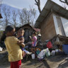 The strong typhoon engulfed villages in floods that trapped residents on roofs, toppled trees and knocked out power in southern and central island provinces, where more than 300,000 villagers had fled to safety before the onslaught, officials said. 