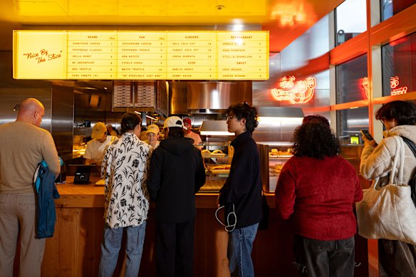 The Docklands location is designed for quick visits, with mostly standing room.