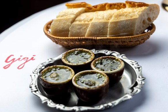 Escargot with garlic and parsley butter (baguette, pictured, is $6 extra).