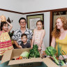 Bridget Choi, her husband Ray and their children (L-R) Norah, Remy and Hazel with their weekly Your Food Collective grocery delivery at home in Sydney's Lane Cove.