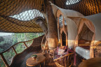 Curvy creation … Tree House, a  whimsically turreted castle of bamboo sitting high in the branches.