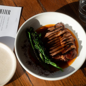 BBQ pork neck with chermoula and broccolini.
