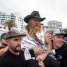 ‘Pretty cooked’: Sydney man surfs more than 700 waves over 40 hours in world record