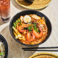 Deeply savoury prawn noodle soup ($16) .