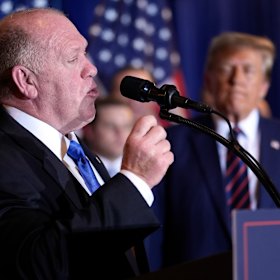 Trump watches as Tom Homan speaks at a primary election night party in January.