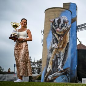 Payne poses in front of Rochester’s famous silo art.