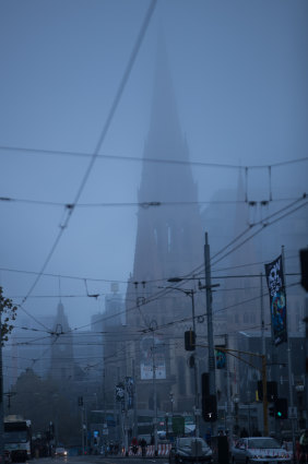 Fog spreads over Swanston Street.