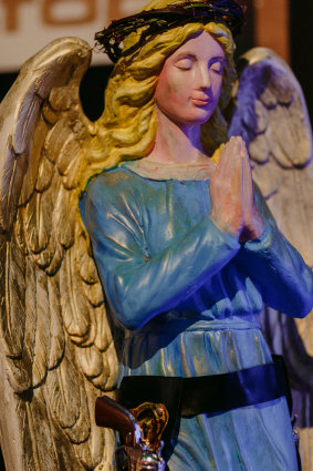 An angel with a holster watches over diners at the Winter Feast.