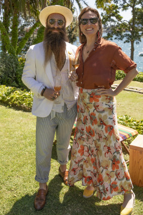 Man about town Jimmy Niggles and Inside Out editor Eliza O'Hare mark World Champagne Day at Darling Point.