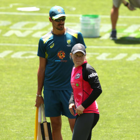 On duty ... Starc trains with Australia as Healy prepares for a Sydney Sixers game.