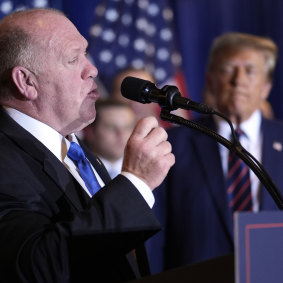 Trump watches as Tom Homan speaks at a primary election night party in January.