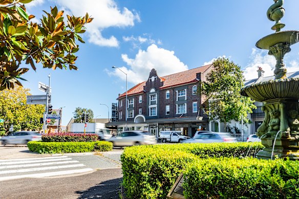 Centennial Flats is a Spanish Mission style building with 10 apartments and four ground floor shops.