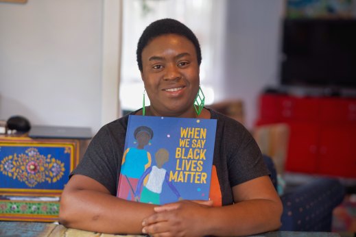 Clarke with her illustrated children’s book, When We Say Black Lives Matter.