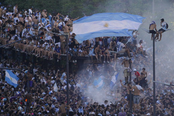 Argentinian soccer fans celebrate their team’s World Cup victory over France, in Buenos Aires.
