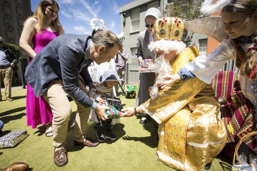 St Nicholas gives toddler Yaroslav Lawriwsky a gift at the Ukrainian Catholic Cathedral in North Melbourne.