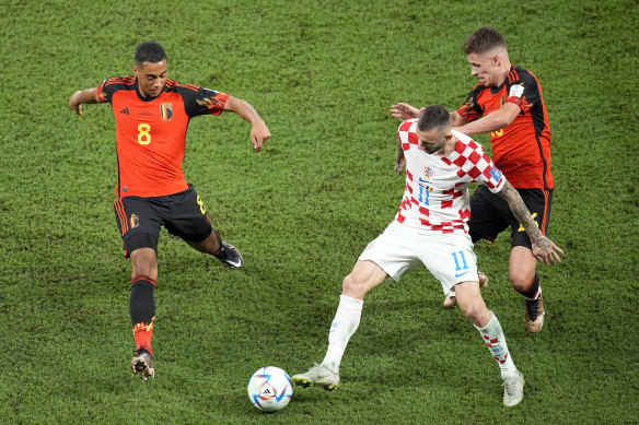 Croatia’s Marcelo Brozovic (11) is defended by Belgium’s Youri Tielemans (8) and Thorgan Hazard (16).