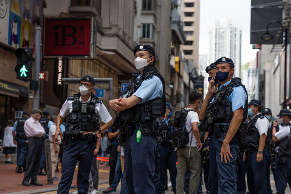lice officers stand guard at the Causeway Bay area outside Victoria Park, the traditional site of the annual Tiananmen candlelight vigil in June 2022.